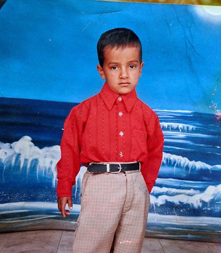 Daud as a kid in a red shirt, studio print from Lahore